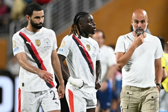 Rayan Aït-Nouri, Jeremy Doku and Pep Guardiola at the 2025 FIFA Club World Cup
