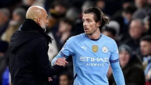 Pep Guardiola and Jack Grealish