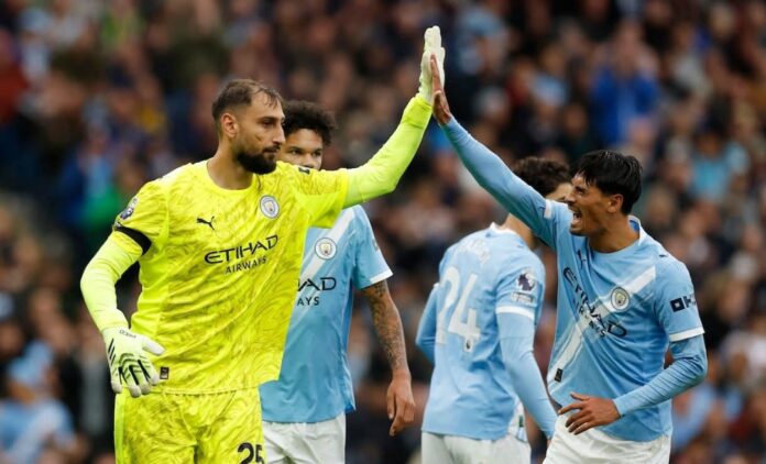 Gianluigi Donnarumma and Tijjani Reijnders