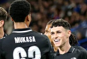 Phil Foden and Divine Mukasa against Huddersfield Town