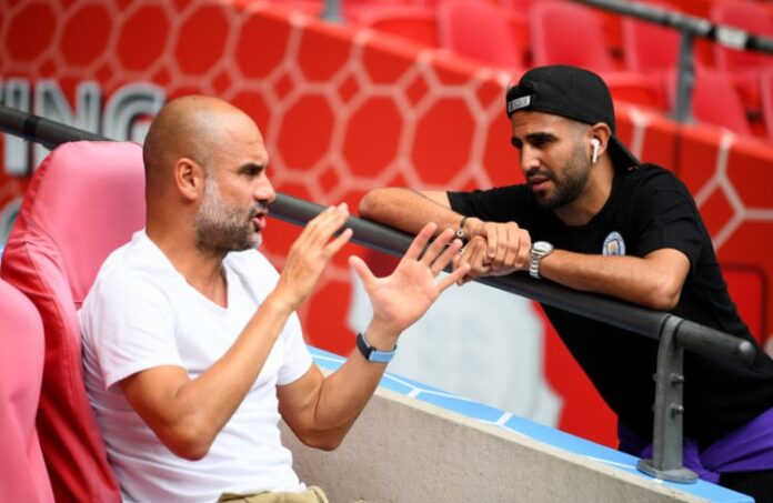 Riyad Mahrez and Pep Guardiola