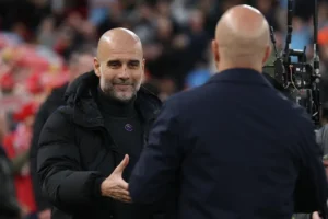 Pep Guardiola and Arne Slot