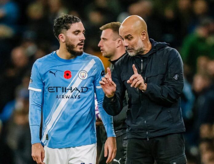 Rayan Cherki and Pep Guardiola