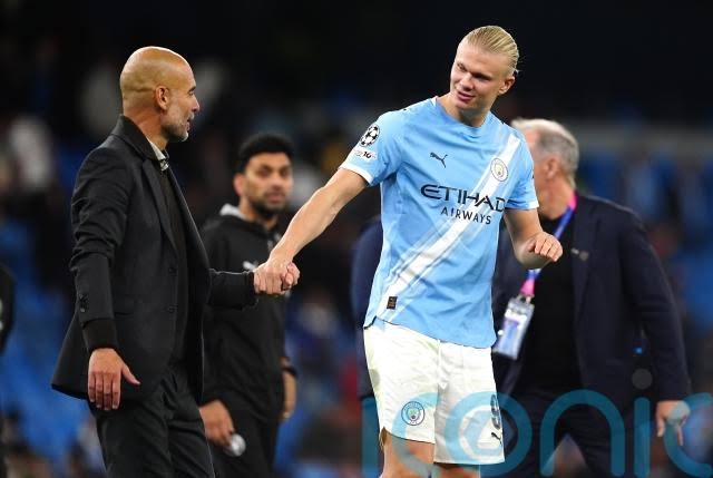 Pep Guardiola and Erling Haaland