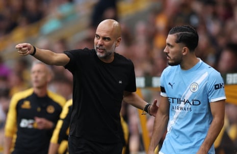 Pep Guardiola and Rayan Cherki