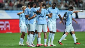 Man City players celebrate