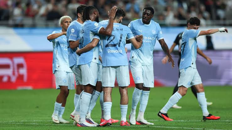 Man City players celebrate